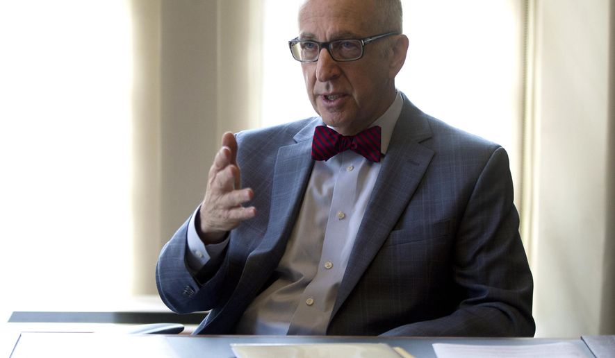 FILE - In this Oct. 5, 2015, file photo, Smithsonian Institution Secretary David Skorton speaks during an interview in his office at the Smithsonian Castle in Washington. Skorton says the government should "take the lead in reinvesting in the arts and humanities." (AP Photo/Carolyn Kaster, File)