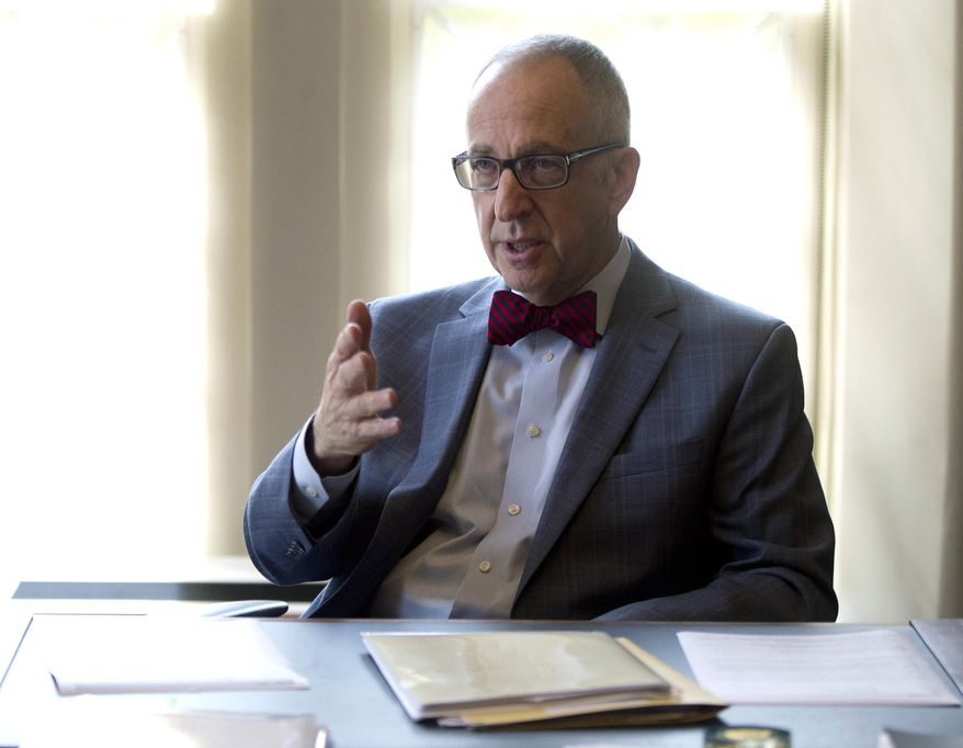 FILE - In this Oct. 5, 2015, file photo, Smithsonian Institution Secretary David Skorton speaks during an interview in his office at the Smithsonian Castle in Washington. Skorton says the government should "take the lead in reinvesting in the arts and humanities." (AP Photo/Carolyn Kaster, File)