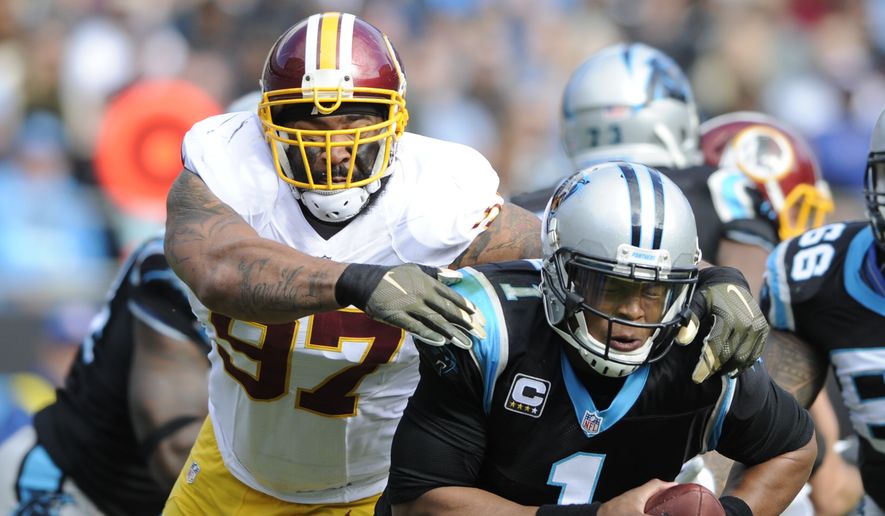 Carolina Panthers&#39; Cam Newton (1) is hit by Washington Redskins&#39; Jason Hatcher (97) defends in the first half of an NFL football game in Charlotte, N.C., Sunday, Nov. 22, 2015. (AP Photo/Mike McCarn)