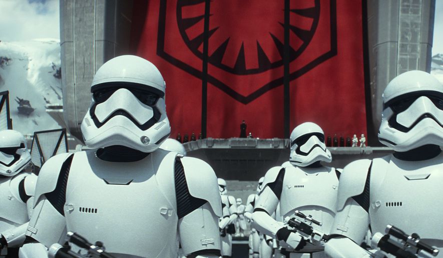 This photo provided by Disney/Lucasfilm shows stormtroopers in a scene from the new film, &quot;Star Wars: The Force Awakens.&quot; The movie releases in the U.S. on Dec. 18, 2015. (Film Frame/Lucasfilm via AP)