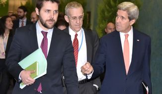 US Secretary of State John Kerry, right, walks with White House senior advisor Brian Deese, left, and US Special Envoy for Climate Change Todd Stern, centre, to attend a meeting with French Foreign Minister  Laurent Fabius during the COP 21 United Nations conference on climate change at Le Bourget, on the outskirts of Paris, on Thursday  Dec. 10, 2015. (Mandel Ngan Pool via AP)