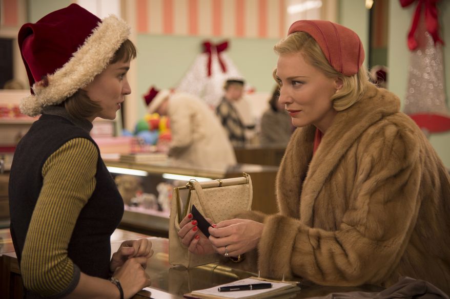 This photo provided by The Weinstein Company shows, Rooney Mara, left, as Therese Belivet, and Cate Blanchett, as Carol Aird, in a scene from the film, "Carol." The film was nominated for a Golden Globe award for best motion picture drama on Thursday, Dec. 10, 2015. Mara and Blanchett were also each nominated for best actress in a drama film. The 73rd Annual Golden Globes will be held on Jan. 10, 2016. (Wilson Webb/The Weinstein Company via AP)