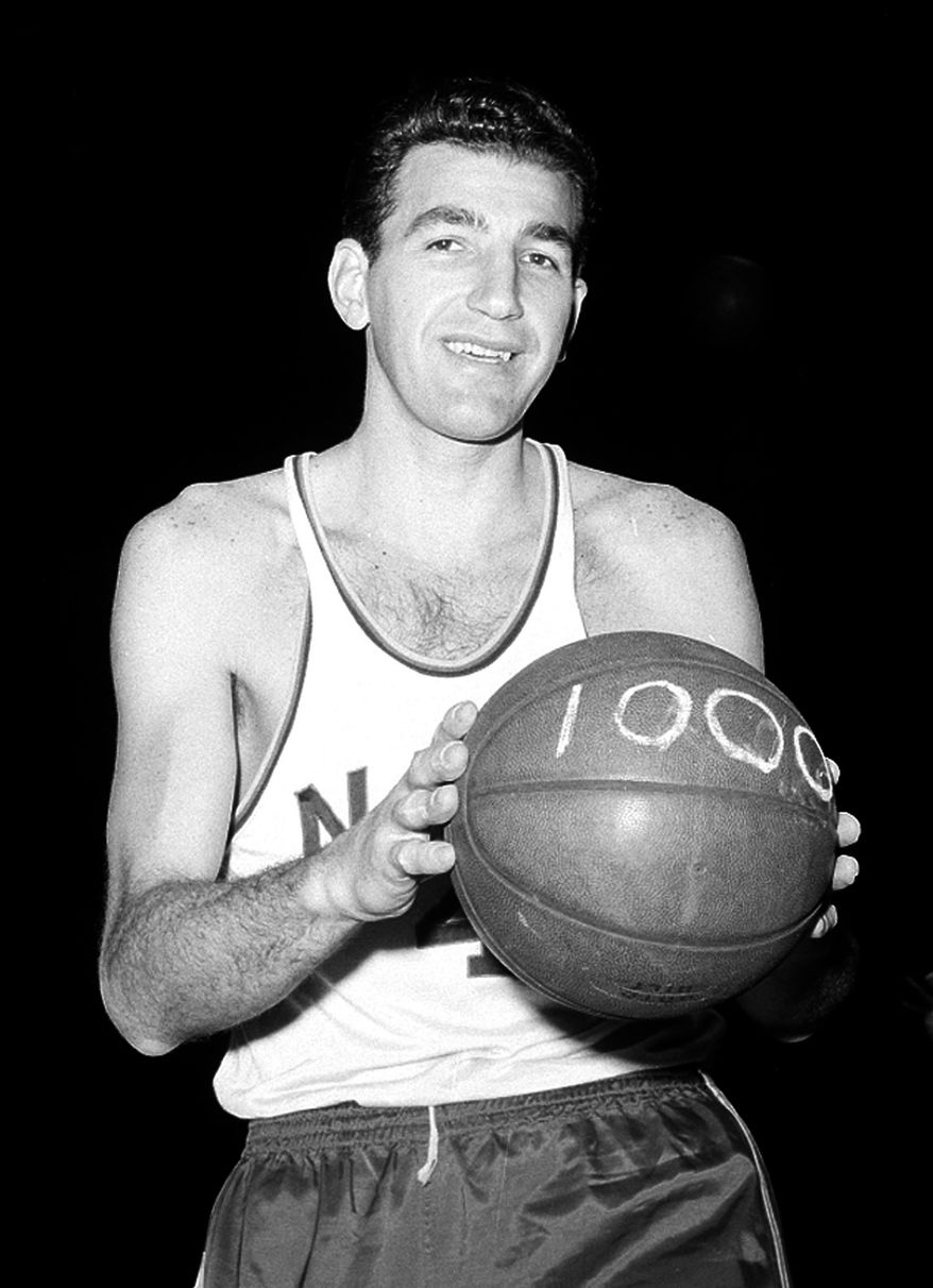 FILE - In this Jan. 22, 1963, file photo, Syracuse Nationals' Dolph Schayes poses at New York's Madison Square Garden shortly before playing his 1,000th game with St. Louis. Hall of Famer Schayes, a 12-time All-Star who refined the big man's role in the infancy of the National Basketball Association, has died. He was 87. Schayes was diagnosed with terminal cancer six months ago and died Thursday, Dec. 10, 2015, after being stricken with a severe infection, his son Danny Schayes said. (AP Photo/File)