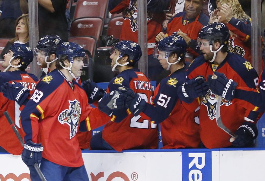 Florida Panthers right wing Jaromir Jagr (68) is congratulated by teammates after scoring during the first period of an NHL hockey game against the Washington Capitals, Thursday, Dec. 10, 2015, in Sunrise, Fla. (AP Photo/Wilfredo Lee)