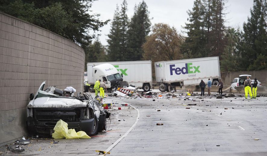 A northbound FedEx double trailer truck sits in the southbound lanes of Interstate 5 after it crossed over the median, striking a southbound pickup and killing its driver at Fruitridge Road and Seamas Avenue on Thursday, Dec. 10, 2015, in Sacramento, Calif.  All lanes of northbound Interstate 5 were closed after the crash. California Highway Patrol Officer Michael Bradley said that the reason for the big rig going out of control is still being investigated but hydroplaning on the wet roadway could be a factor. (Randy Pench/The Sacramento Bee via AP)  MAGS OUT; LOCAL TELEVISION OUT (KCRA3, KXTV10, KOVR13, KUVS19, KMAZ31, KTXL40); MANDATORY CREDIT