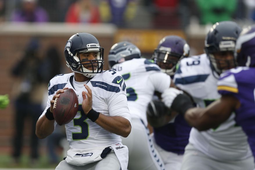 FILE - In this Sunday, Dec. 6, 2015 file photo, Seattle Seahawks quarterback Russell Wilson (3) looks to throw against the Minnesota Vikings in the first half of an NFL football game in Minneapolis. The Seattle Seahawks will play the Baltimore Ravens on Sunday, Dec. 13, 2015. (AP Photo/Jim Mone, File)