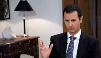 In this photo released by the Syrian official news agency SANA, Syrian President Bashar Assad speaks during an interview with the Spanish news agency EFE, in Damascus, Syria, Friday, Dec. 11, 2015. Assad said in the interview that Saudi Arabia, the United States and some Western countries want &quot;terrorist groups&quot; to join peace negotiations to try end Syria&#39;s civil war. The Syrian government refers to all insurgent groups as terrorists. (SANA via AP) ** FILE **