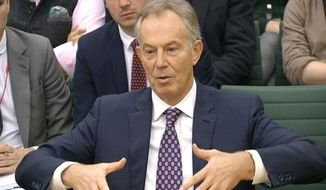In this image taken from TV, former British Prime Minister Tony Blair gestures while appearing in front of the Foreign Affairs Select Committee at the House of Commons in London on Friday Dec. 11, 2015, where he is giving evidence on Britain&#x27;s foreign policy towards Libya. (PA via AP) ** FILE **