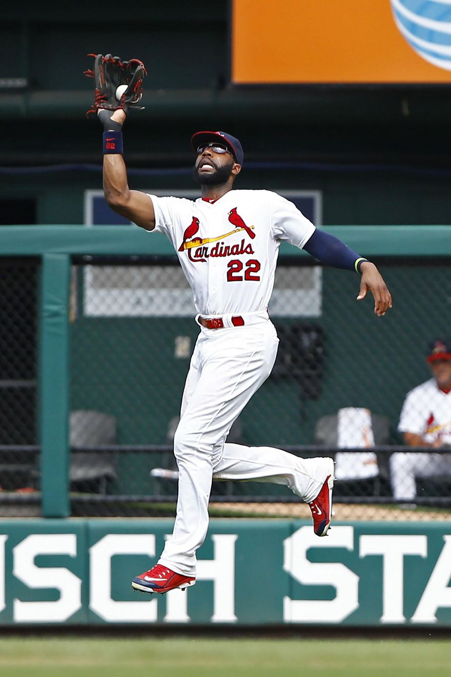 FILE - In this Sunday, July 26, 2015 file photo, St. Louis Cardinals right fielder Jason Heyward makes a leaping catch on a ball hit by Atlanta Braves' Nick Markakis during the ninth inning of a baseball game in St. Louis. A person familiar with the negotiations says the Chicago Cubs and free agent outfielder Jason Heyward have agreed to a $184 million, eight-year contract, Friday, Dec. 11, 2015. (AP Photo/Billy Hurst, File)