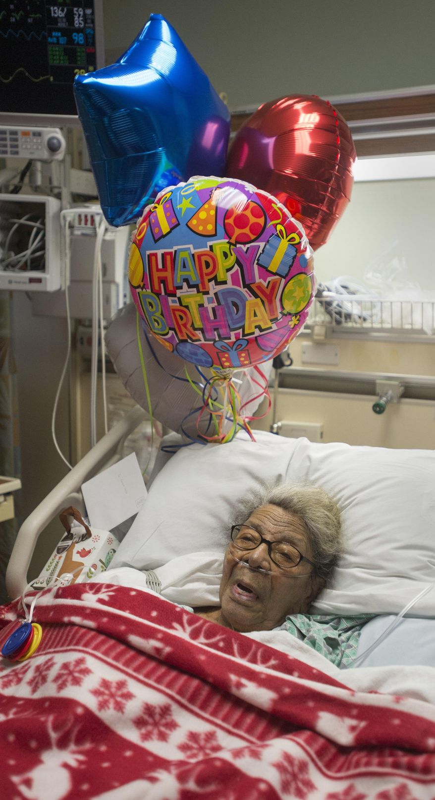 Emma Voss rests in bed on her 106th birthday at Covenant HealthCare, in Saginaw, Mich., on Thrusday, Dec. 10, 2015. Voss spent her birthday Thursday surrounded by relatives in the intensive care unit after surgery to have a pacemaker implanted. After her hospital stay she plans to return to her home, and resume cooking. (Jeff Schrier/The Saginaw News via AP) ALL LOCAL TELEVISION OUT; LOCAL TELEVISION INTERNET OUT; MANDATORY CREDIT