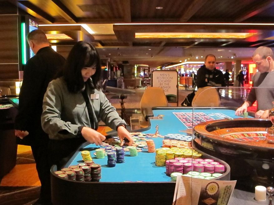 This April 17, 2015 photo shows a dealer counting chips during a game of roulette at the Tropicana Casino and Resort in Atlantic City, N.J. On Friday Dec. 11, 2015, New Jersey lawmakers said they will seek a statewide referendum in Nov. 2016 in which voters would be asked whether to approve two new casinos in the northern part of the state. Expanding casino gambling beyond Atlantic City requires amending the state Constitution. (AP Photo/Wayne Parry)