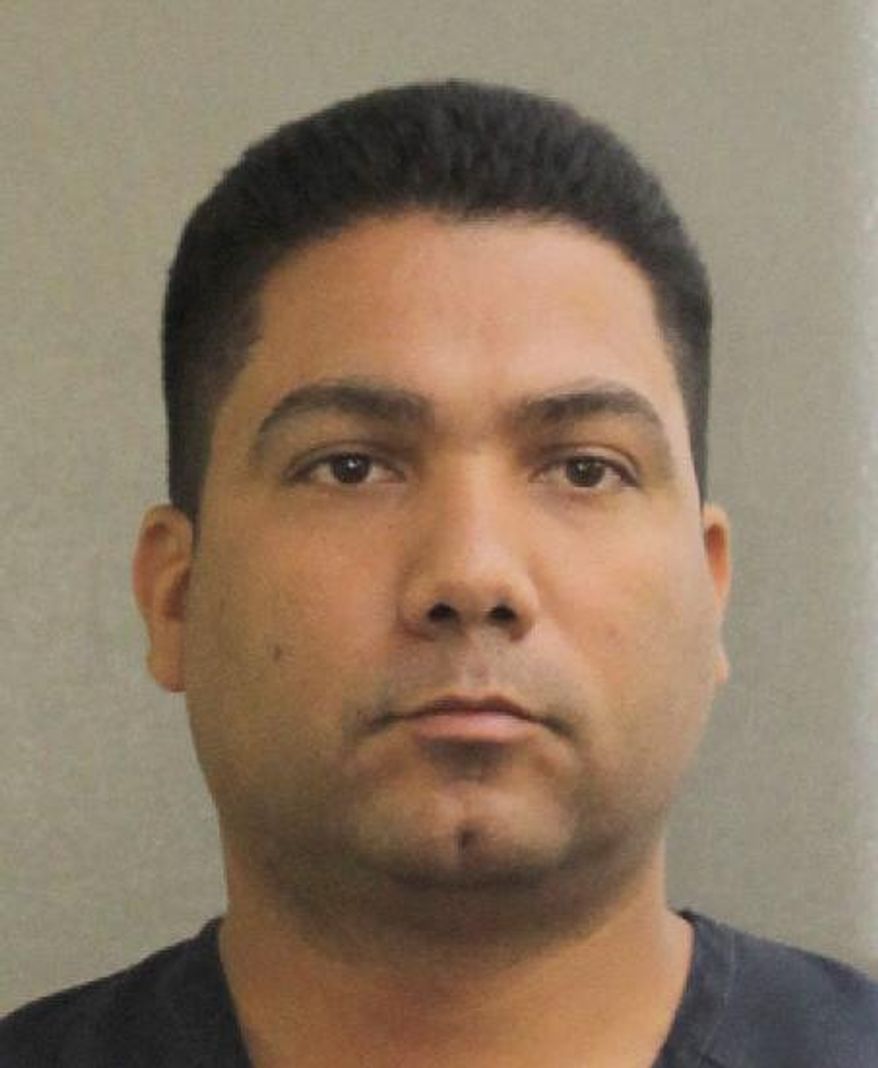 In this photo provided by the Broward County Sheriff's Office is Broward sheriff's deputy Peter Peraza, who has been charged with manslaughter in the 2013 shooting death of 33-year-old Jermaine McBean, who was carrying only an air rifle and may have been unable to hear police commands because he was listening to music through earbuds. (Broward Sheriff's Office via AP)