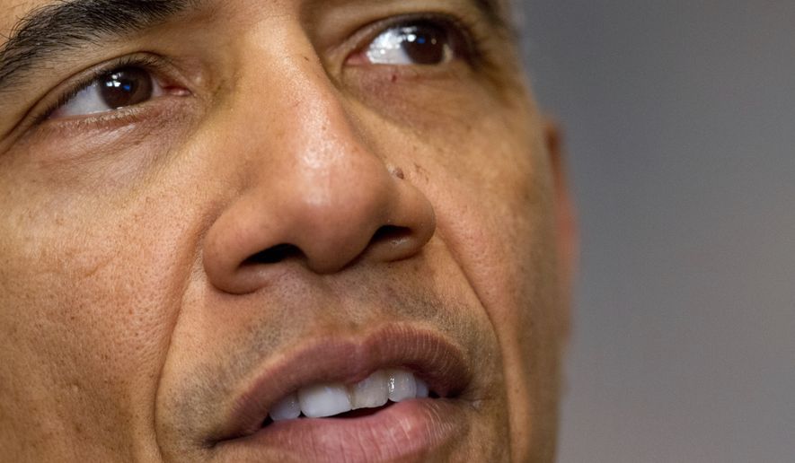 President Barack Obama speaks about the Paris climate agreement from the Cabinet Room of the White House in Washington, Saturday, Dec. 12, 2015. (AP Photo/Jacquelyn Martin)