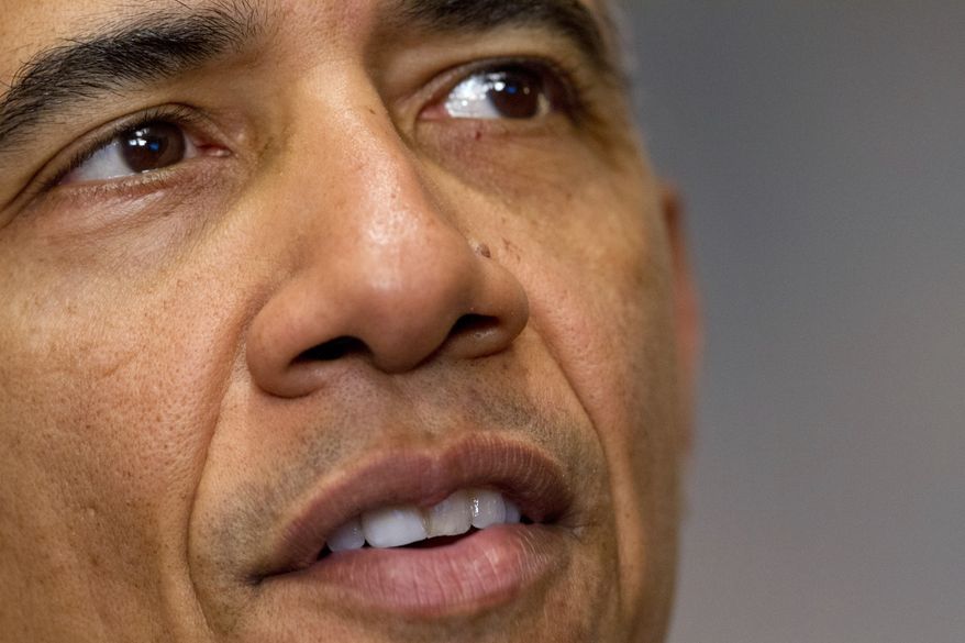 President Barack Obama speaks about the Paris climate agreement from the Cabinet Room of the White House in Washington, Saturday, Dec. 12, 2015. (AP Photo/Jacquelyn Martin)