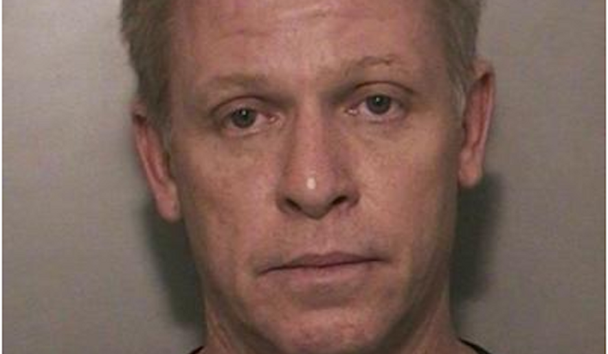 Breen Peck, 52, an air traffic controller, was arrested in Long Island Wednesday on illegal weapons and drug charges. (Image: Nassau County Police Department)