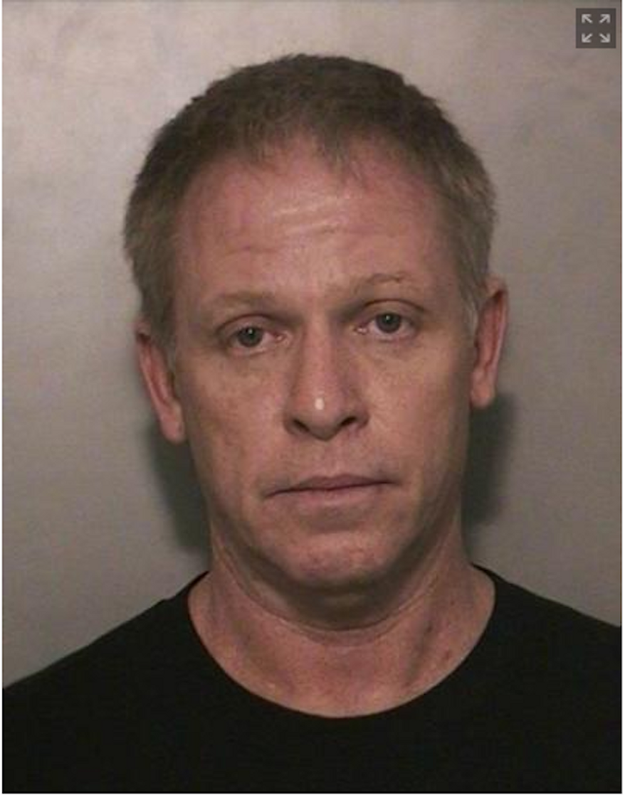 Breen Peck, 52, an air traffic controller, was arrested in Long Island Wednesday on illegal weapons and drug charges. (Image: Nassau County Police Department)