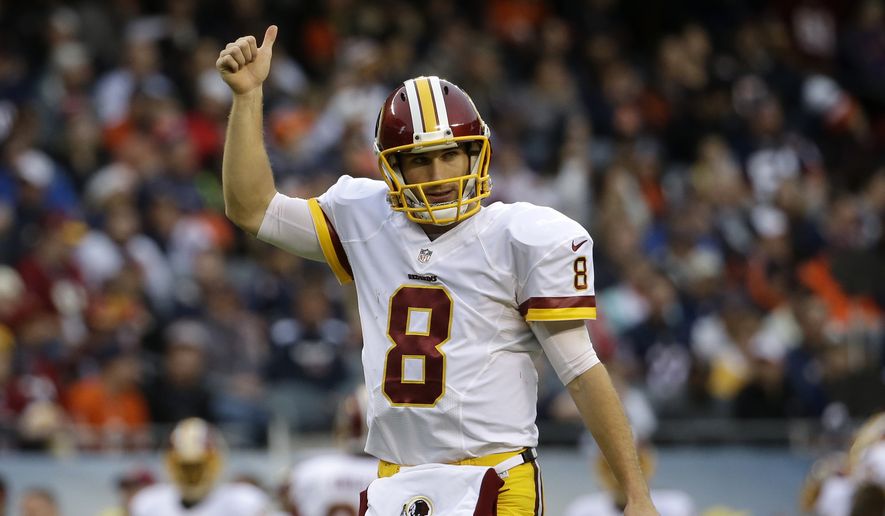 Washington Redskins quarterback Kirk Cousins (8) reacts after a touchdown during the first half of an NFL football game against the Chicago Bears, Sunday, Dec. 13, 2015, in Chicago. (AP Photo/Nam Y. Huh)
