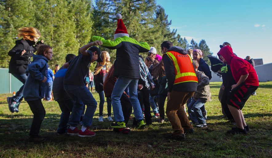 ADVANCE FOR THE WEEKEND OF DEC. 12-13 AND THEREAFTER - In this Dec. 1, 2015 photo, sixth-grade students jump in the air to help researchers measure the way seismic waves move through soil at Lackamas Elementary School in Yelm, Thurston County, Wash. (Ellen M. Banner/The Seattle Times via AP) SEATTLE OUT; USA TODAY OUT; MAGS OUT; TELEVISION OUT; NO SALES; MANDATORY CREDIT TO BOTH THE SEATTLE TIMES AND THE PHOTOGRAPHER, ELLEN M. BANNER