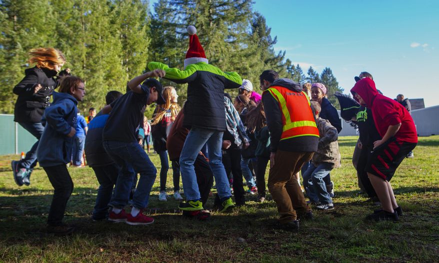 ADVANCE FOR THE WEEKEND OF DEC. 12-13 AND THEREAFTER - In this Dec. 1, 2015 photo, sixth-grade students jump in the air to help researchers measure the way seismic waves move through soil at Lackamas Elementary School in Yelm, Thurston County, Wash. (Ellen M. Banner/The Seattle Times via AP) SEATTLE OUT; USA TODAY OUT; MAGS OUT; TELEVISION OUT; NO SALES; MANDATORY CREDIT TO BOTH THE SEATTLE TIMES AND THE PHOTOGRAPHER, ELLEN M. BANNER