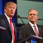 Republican presidential candidates Donald Trump and Jeb Bush participate in the first Republican presidential debate at the Quicken Loans Arena in Cleveland on Aug. 6, 2015. (Associated Press) **FILE**