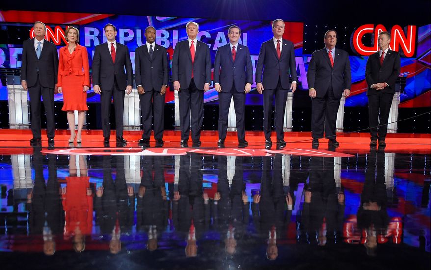 Republican presidential candidates (from left) John Kasich, Carly Fiorina, Marco Rubio, Ben Carson, Donald Trump, Ted Cruz, Jeb Bush, Chris Christie and Rand Paul take the stage during the CNN Republican presidential debate at the Venetian Hotel &amp; Casino on Tuesday in Las Vegas. (Associated Press)