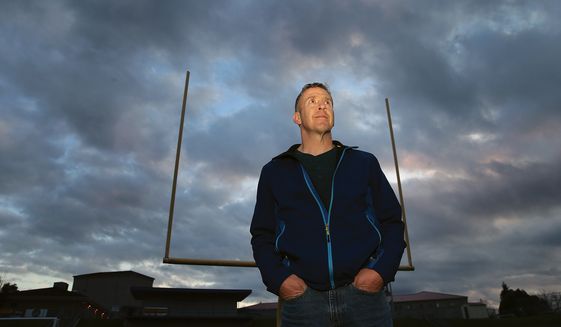 Former Bremerton High School assistant football coach Joseph Kennedy, who was suspended for praying at midfield after games, has filed a discrimination complaint with the U.S. Equal Employment Opportunity Commission, according to The Liberty Institute, a Texas-based law firm representing the coach. (Kitsap Sun via Associated Press/File)