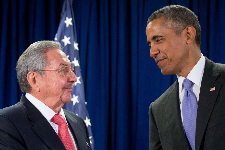 U.S. President Barack Obama stands with Cuba&#39;s President Raul Castro before a bilateral meeting at the United Nations headquarters on Sept. 29, 2015. (Associated Press) **FILE**