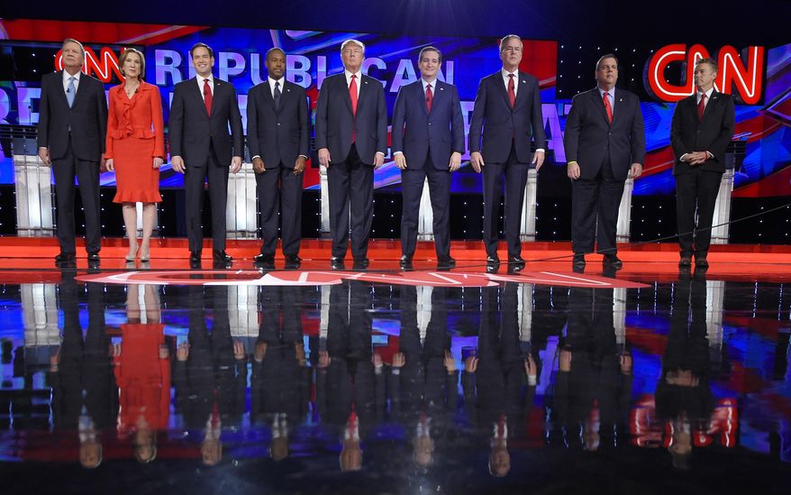 Republican presidential candidates, from left, John Kasich, Carly Fiorina, Marco Rubio, Ben Carson, Donald Trump, Ted Cruz, Jeb Bush, Chris Christie, and Rand Paul take the stage during the CNN Republican presidential debate at the Venetian Hotel & Casino on Tuesday, Dec. 15, 2015, in Las Vegas. (AP Photo/Mark J. Terrill)