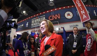 Carly Fiorina talks to the press in the spin room following the CNN Republican presidential debate at the Venetian Hotel &amp; Casino on Tuesday, Dec. 15, 2015, in Las Vegas. (AP Photo/Mark J. Terrill)