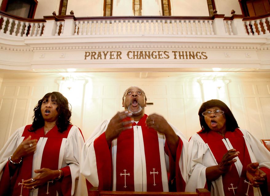 In this Thursday, Dec. 10, 2015 photo, members of the St. James Methodist Church's choir Harolyn Brooks, from left, Joe Humphrey and Dorothy Seale rehearse for Sunday's service in Waco, Texas. The church, founded by slaves and considered one of the oldest black churches in town, is down to 20 or 30 members and maybe forced to close while members look for a smaller building. (Jerry Larson/Waco Tribune Herald via AP) MANDATORY CREDIT