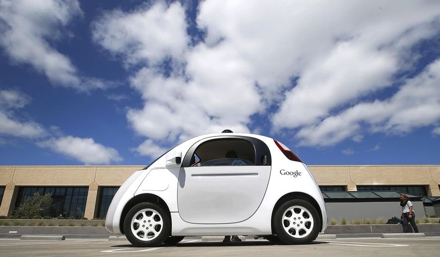 FILE - In this May 13, 2015, file photo, Google's new self-driving prototype car is presented during a demonstration at the Google campus in Mountain View, Calif. California unveiled precedent-setting draft rules Wednesday, Dec. 16, 2015 that would slow the public's access to self-driving cars of the future until regulators are confident the technology is safe. (AP Photo/Tony Avelar, File)