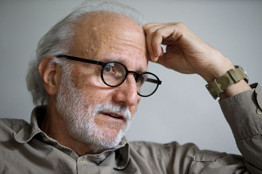 In this photo taken Dec. 11, 2015, Alan Gross is interviews in his home in Washington. Alan Gross spent five years in a Cuban prison. Gross spent five years in a Cuban prison before being released last year as part of a historic reopening of relations between the United States and Cuba, but he says he'd travel back to the island nation "in a heartbeat, as long as the government promises not to re-arrest me."(AP Photo/Jacquelyn Martin)