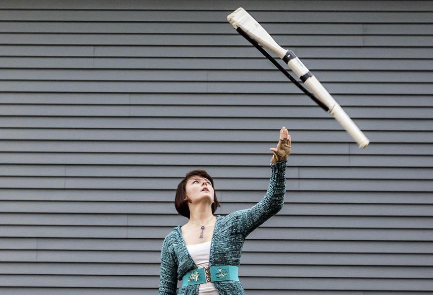In this Nov. 18, 2015 photo, Kayla Janz, 17, practices for winter guard outside her home in McHenry, Ill. For one year, Janz cut added sugars from her diet and saw significant health improvements. She had less complex migraine spells, had more energy, less acne, softer skin and wasn’t as hungry in between meals, she said. (Sarah Nader/Northwest Herald via AP) CHICAGO TRIBUNE OUT, MANDATORY CREDIT