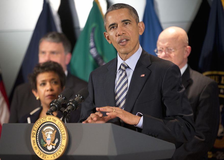President Barack Obama speak at the National Counterterrorism Center in McLean, Va., on Dec. 17, 2015. Joining him are (from left) National Counterterrorism Center Director Nicholas Rasmussen, Attorney General Loretta Lynch and Office of National Intelligence Director James Clapper. (Associated Press) **FILE**