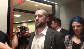 FILE - In this May 29, 2015, file photo, television actor Dustin Diamond, center, leaves court in Port Washington, Wis., after being convicted of two misdemeanors stemming from a barroom fight on Christmas Day 2014. Former “Saved by the Bell” actor Diamond will start serving his four-month jail sentence with work release in January 2016 for an altercation at a Wisconsin bar. (AP Photo/Dana Ferguson, File)