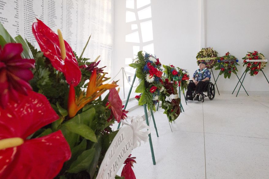 ADVANCE FOR THE WEEKEND OF DEC. 19-20 AND THEREAFTER - In this Dec. 12, 2015 photo, U.S.S. Arizona crew member and survivor Lauren Bruner, 95, visit the U.S.S. Arizona memorial in Honolulu. Coming as early as January is a smartphone application that will walk visitors through a bit of Hawaii in late 1941 through Bruner’s eyes and period photos immediately before, during and after the day of infamy. (Cindy Ellen Russell/Honolulu Star-Advertiser via AP)