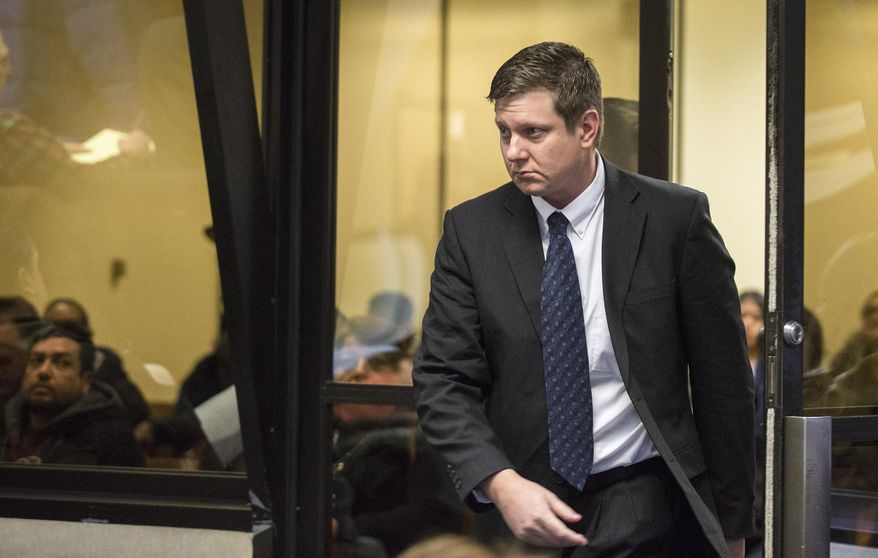 Chicago police Officer Jason Van Dyke arrives for a court hearing at the Leighton Criminal Court Building in Chicago on Friday, Dec. 18, 2015. It was Van Dyke’s first appearance in court since a grand jury indicted him on Wednesday, Dec. 16. He faces six counts of first-degree murder and one of official misconduct in the 2014 shooting death of 17-year-old Laquan McDonald. (Zbigniew Bzdak/Pool Chicago Tribune via AP, Pool)
