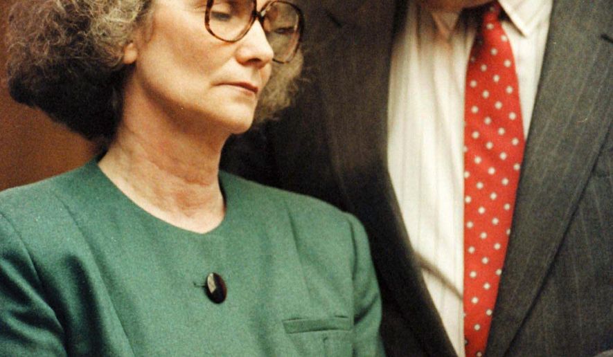 FILE - In this 1990 file photo, Blanche Taylor Moore, left, reacts with her attorney David Tamer as she is sentenced to death in Winston-Salem, N.C. Moore was convicted of murdering her boyfriend, Raymond Reid. In 2015, Moore remains at the N.C. Correctional Institution for Women. She is one of 148 people awaiting execution in North Carolina. At 82, she is the state’s oldest death-row inmate, the second-longest serving and one of only two women.  (AP Photo/Chuck Burton, File)