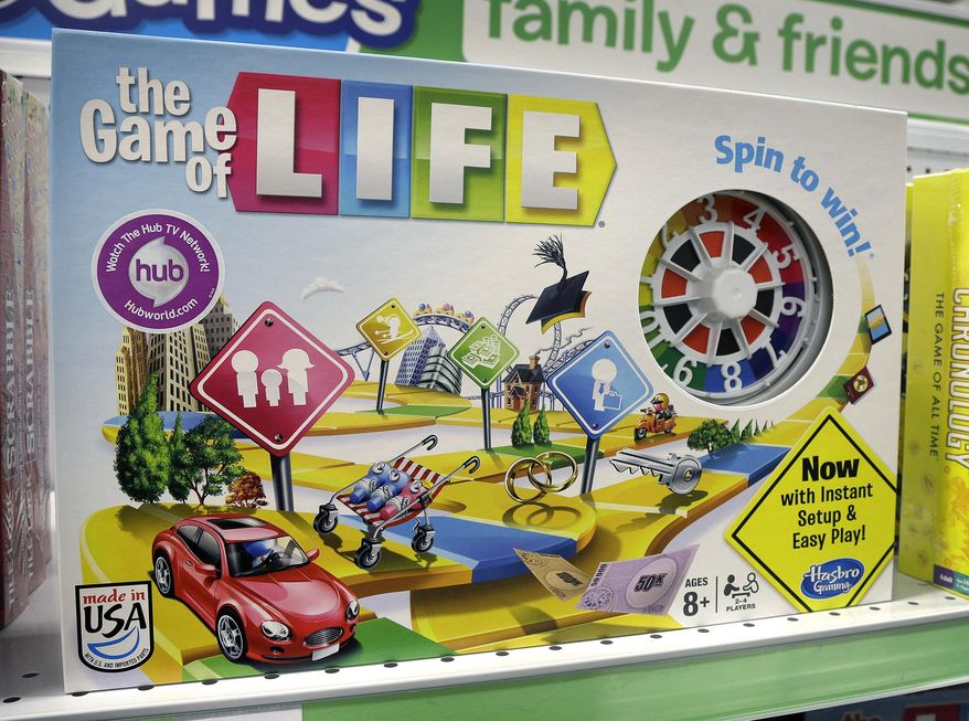 FILE - In this Wednesday, Nov. 11, 2015 file photo, the Hasbro board game "The Game of Life" rests on a shelf in a toy store in North Attleboro, Mass. Hasbro is hitting back in a lawsuit from a toy inventor's widow who says her husband invented The Game of Life. In its first response to the lawsuit on Friday, Dec. 18, 2015, Hasbro Inc. denies that toy inventor Bill Markham created or designed the game, and says his widow has no ownership interest in it. The board game is one of the most popular in history. (AP Photo/Steven Senne, File)