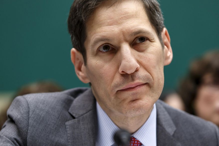 FILE - In this Oct. 16, 2014 file photo, Centers for Disease Control and Prevention (CDC) Director Dr. Tom Frieden, listens as he testifies on Capitol Hill in Washington. A bold federal effort to curb prescribing of painkillers may be faltering, amid stiff resistance from drugmakers, industry-funded groups and the government’s own top drug regulator. The agency has abandoned the January 2016 target date and opened the recommendations to public comment for 30 days. (AP Photo/J. Scott Applewhite)
