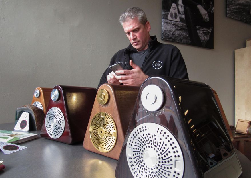 FOR RELEASE SUNDAY, DECEMBER 20, 2015, AT 1:00 A.M. CST. Princeton Audio was founded in 2014 in downtown Princeton, a city of 1,192 in Green Lake County. The company is in the midst of raising capital so that it can ramp up production of its wireless speaker system housed in maple, cherry, mahogany, black walnut and other wood types. The speakers feature a proprietary and removable combination USB and plug that allows the speaker to adapt to changing technology. Founders Mike Pelland, pictured Wednesday, Dec. 9, 2015, and his wife, Beth, want to bring manufacturing jobs back to the city and believe they could create 40 full time jobs and have annual sales near $80 million by 2020. (Barry Adams/Wisconsin State Journal via AP)