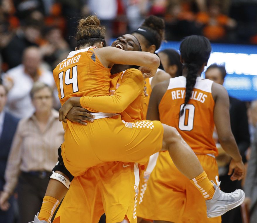 Tennessee's Andraya Carter, left, and Meme Jackson celebrate Tennessee's 53-50 win over Oregon State in an NCAA college basketball game, in Corvallis, Ore., on Saturday, Dec. 19, 2015. (AP Photo/Timothy J. Gonzalez)