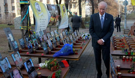 Vice President Joseph R. Biden paid his respects in honor of the "Heavenly Hundred" during a ceremony at the monument dedicated to them in Kiev, Ukraine, on Dec. 7. The "Heavenly Hundred" is what Ukrainians call those who died during months of anti-government protests two years ago that ended in new leadership but not much change. (Associated Press)