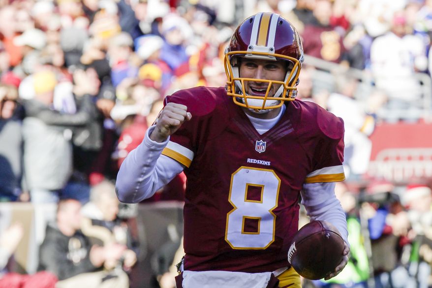 Washington Redskins quarterback Kirk Cousins (8) celebrates his touchdown during the first half of an NFL football game against the Buffalo Bills in Landover, Md., Sunday, Dec. 20, 2015. (AP Photo/Mark Tenally) **FILE**
