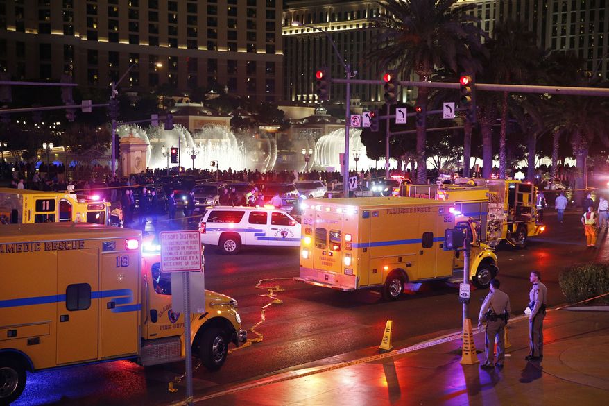 Police and emergency crews respond to the scene of a car accident along Las Vegas Boulevard on Sunday in Las Vegas. (Associated Press)