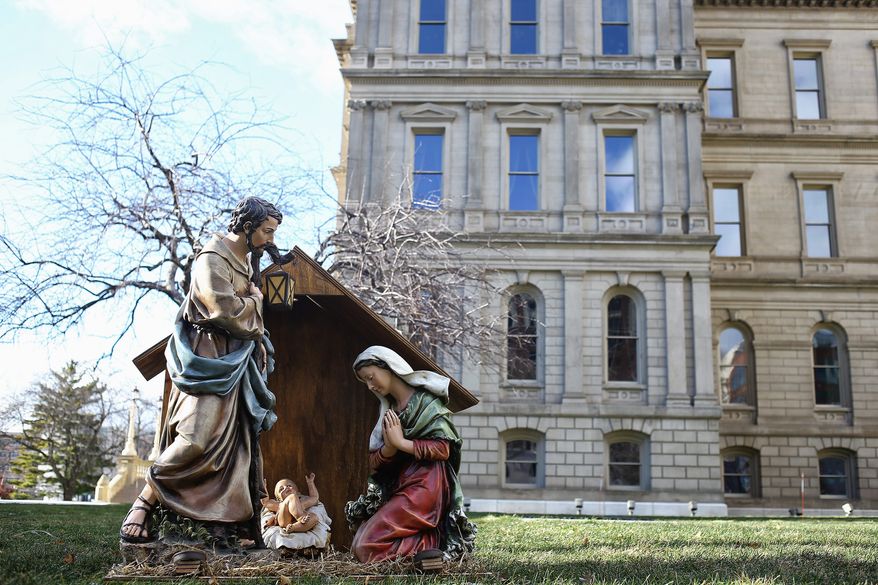 A Nativity display from a Christian sits on the west side of the Capitol lawn in Lansing, Michigan. The lawn also has a display of the Satanic Temple from Detroit&#39;s &quot;Snaketivity&quot; scene. (Associated Press)