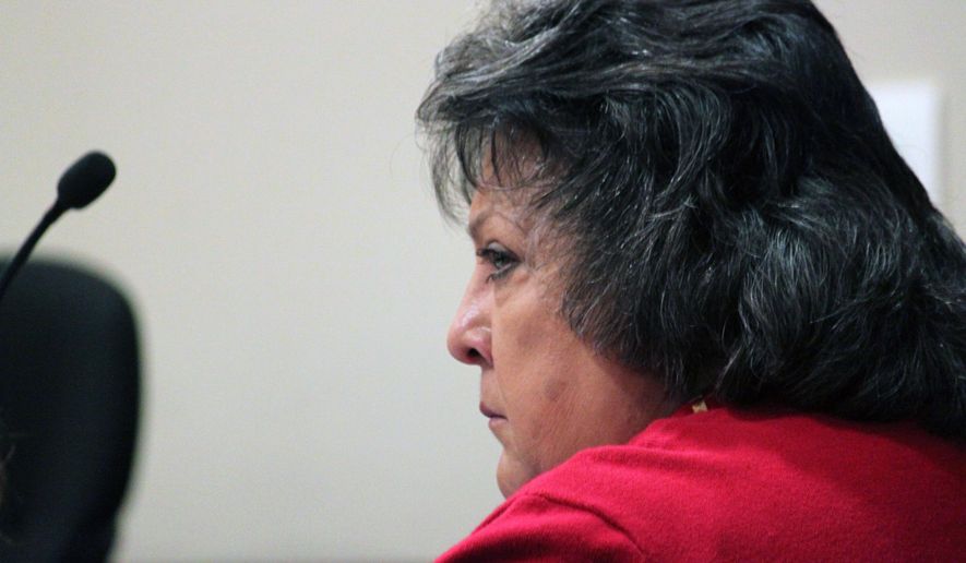 FILE - In this Tuesday, Dec. 8, 2015, file photo, former New Mexico Secretary of State Dianna Duran listens to prosecutors during a motions hearing in Santa Fe, N.M. Duran was able to funnel thousands of dollars in campaign donations to her private bank accounts during a gambling binge without any regulatory agency noticing that she was breaking the law. Duran's own agency was in charge of regulating campaign finance, but it was a confidential tip about numerous cash deposits that led to her getting caught. (AP Photo/Susan Montoya Bryan, File)