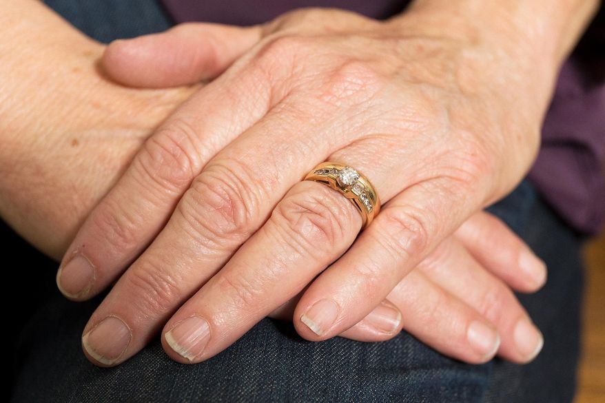 In this Friday, Dec. 11, 2015 photo, Dora Van Dyke, of Hayden Lake, Idaho, poses for a photo in Coeur d'Alene, Idaho. Van Dyke lost her wedding ring in October and it was found earlier this month and returned by with Randy Fraker, a Twin Lakes, Idaho resident. (Shawn Gust/Coeur D'Alene Press via AP) MANDATORY CREDIT