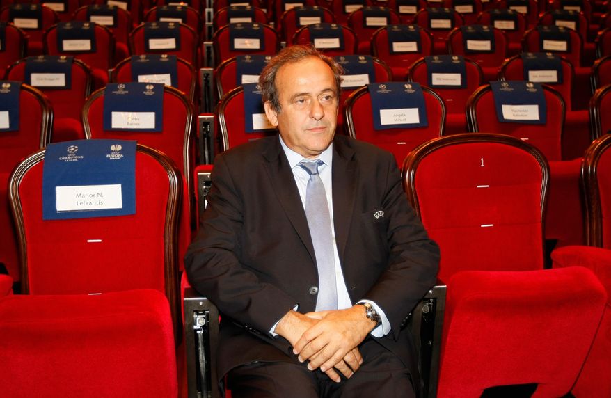 FILE - In this Aug. 28, 2015 file photo UEFA President Michel Platini, attends the soccer Europa League draw ceremony at the Grimaldi Forum, in Monaco. Sepp Blatter and Michel Platini have been banned for 8 years, the FIFA ethics committee said Monday, Dec. 21, 2015. (AP Photo/Claude Paris, file)