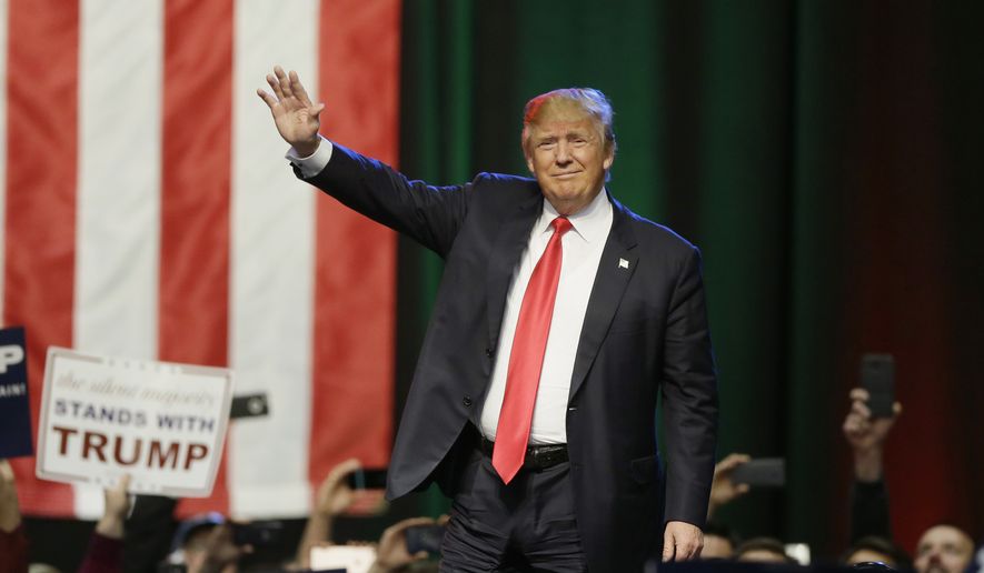 Republican presidential candidate businessman Donald Trump acknowledges the crowd before addressing supporters at a campaign rally in Grand Rapids, Mich., in this Dec. 21, 2015, file photo. (AP Photo/Carlos Osorio) **FILE**